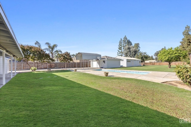 view of yard with a patio area and a fenced in pool