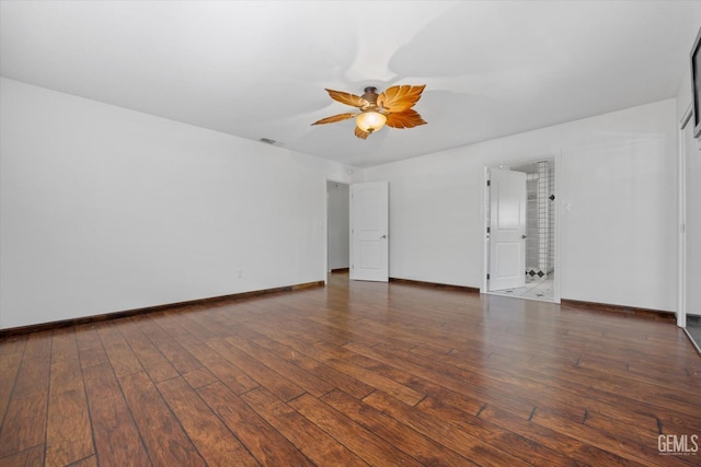 unfurnished room featuring ceiling fan and dark wood-type flooring