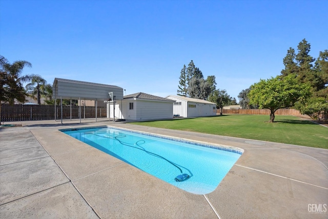 view of pool with a yard and a patio area