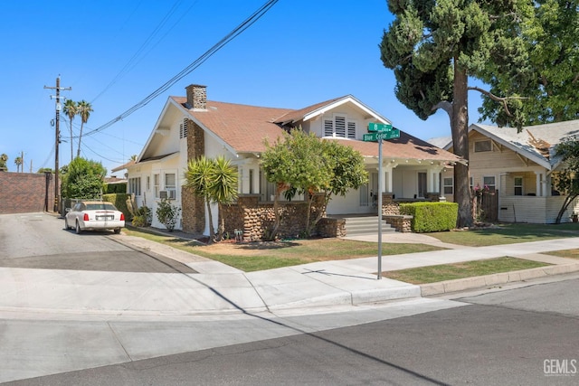 2310 B St, Bakersfield, CA 93301 - view of front facade featuring covered porch, a chimney, and concrete driveway