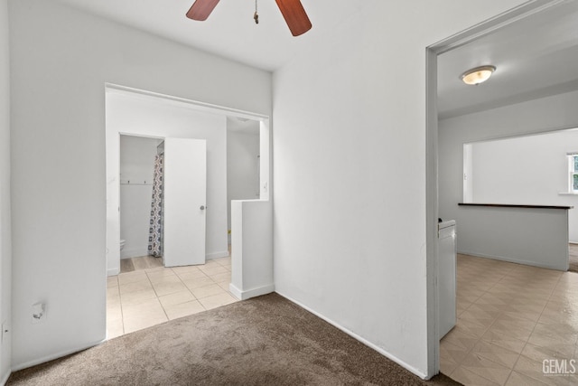 2310 B St, Bakersfield, CA 93301 - carpeted empty room featuring ceiling fan and tile patterned flooring