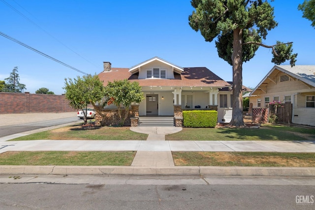 2310 B St, Bakersfield, CA 93301 - view of front facade with a chimney and covered porch