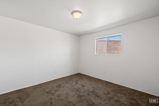 2310 B St, Bakersfield, CA 93301 - carpeted empty room featuring baseboards
