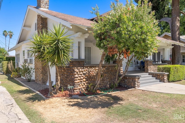 2310 B St, Bakersfield, CA 93301 - obstructed view of property featuring a chimney and covered porch