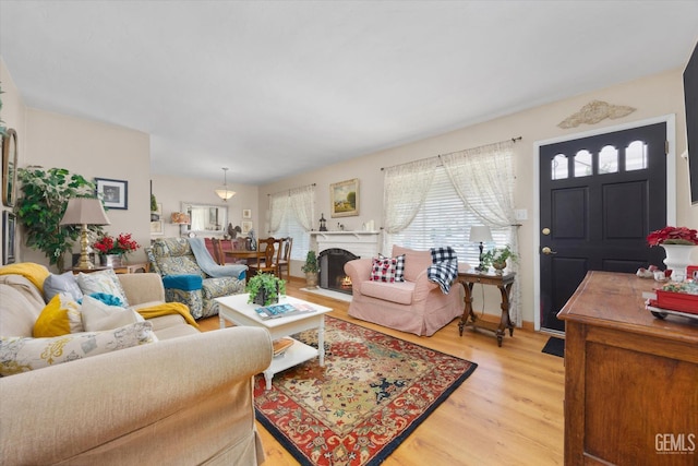 3808 Navajo Ave, Bakersfield, CA 93309 - living area with plenty of natural light, light wood-type flooring, and a fireplace