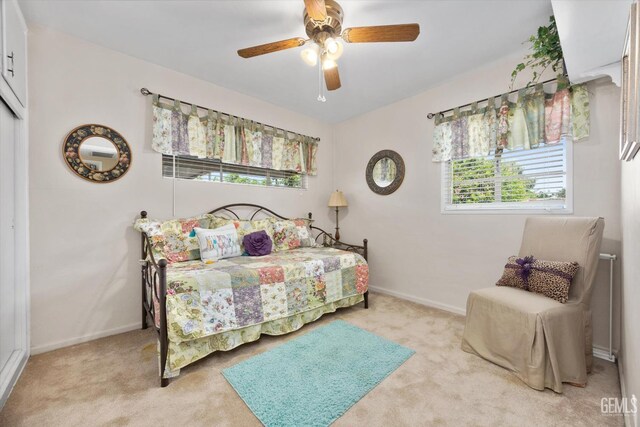 3808 Navajo Ave, Bakersfield, CA 93309 - bedroom with light carpet and a ceiling fan