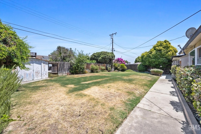 3808 Navajo Ave, Bakersfield, CA 93309 - fenced backyard with a storage unit