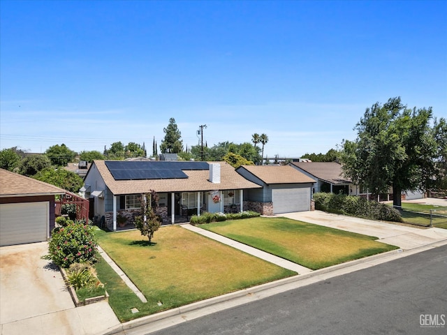 3808 Navajo Ave, Bakersfield, CA 93309 - ranch-style house with driveway, solar panels, a front yard, and a garage