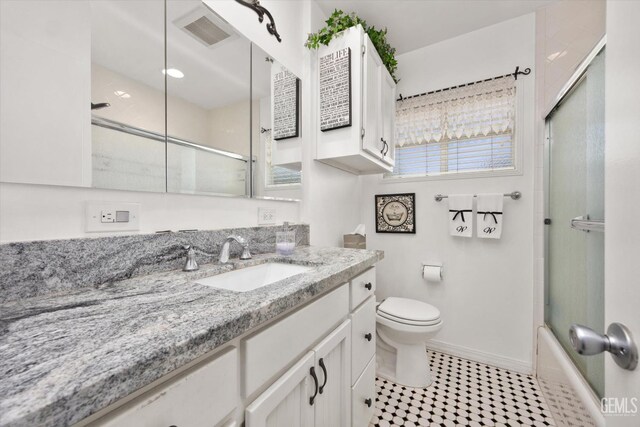 3808 Navajo Ave, Bakersfield, CA 93309 - bathroom featuring vanity, combined bath / shower with glass door, and tile patterned floors