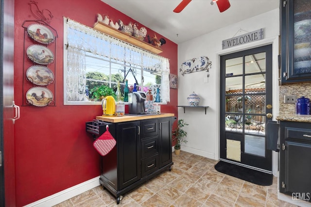 3808 Navajo Ave, Bakersfield, CA 93309 - bar with baseboards and a ceiling fan