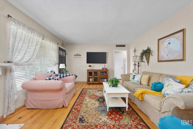 3808 Navajo Ave, Bakersfield, CA 93309 - living room with light wood-type flooring and baseboards