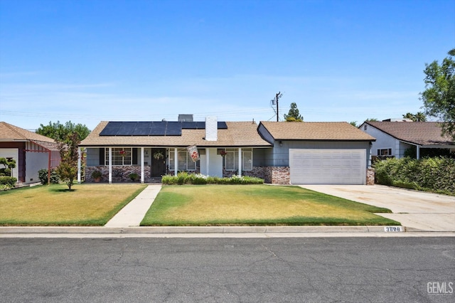 3808 Navajo Ave, Bakersfield, CA 93309 - single story home with an attached garage, a front yard, a porch, concrete driveway, and roof mounted solar panels