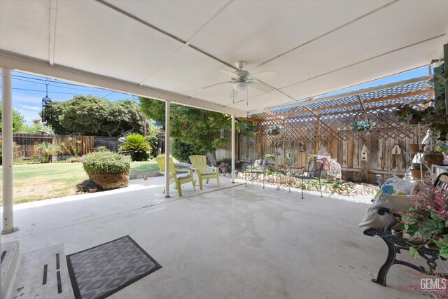3808 Navajo Ave, Bakersfield, CA 93309 - fenced backyard with a ceiling fan and a patio area
