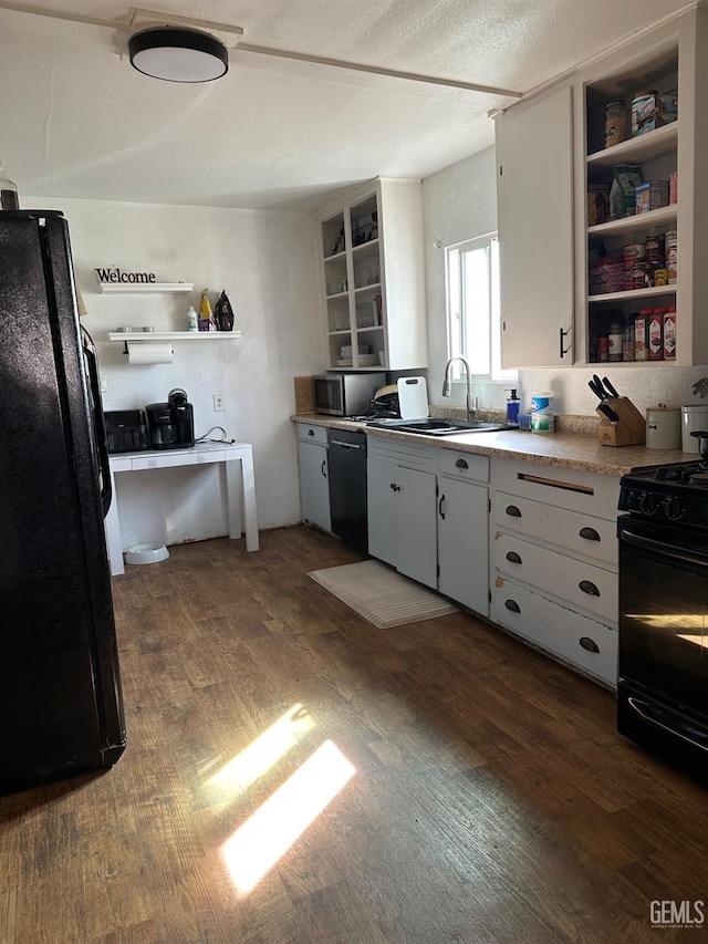 kitchen featuring black appliances, light countertops, open shelves, and white cabinetry