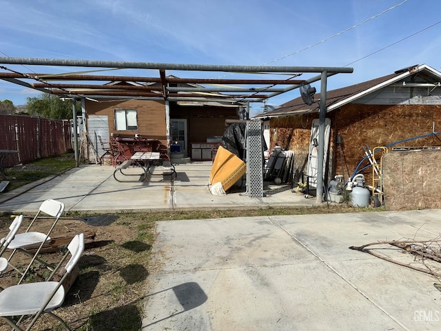 view of patio featuring fence