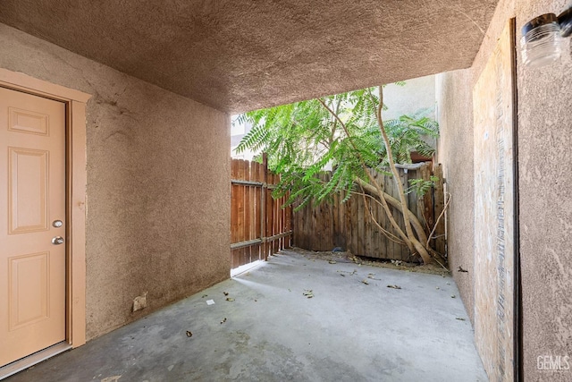 view of patio featuring fence