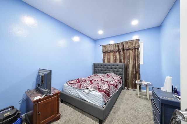 carpeted bedroom with recessed lighting
