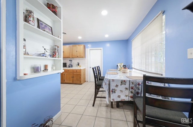 dining area with light tile patterned flooring and recessed lighting