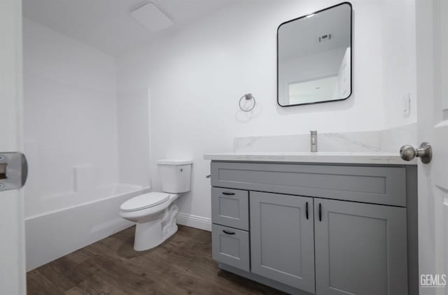 2625 Security Ave, Bakersfield, CA 93306 - full bathroom with visible vents, wood finished floors, vanity, baseboards, and toilet