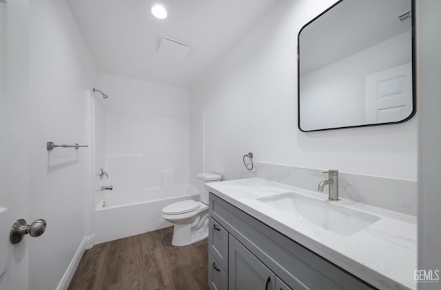2625 Security Ave, Bakersfield, CA 93306 - full bath with vanity, washtub / shower combination, wood finished floors, and toilet
