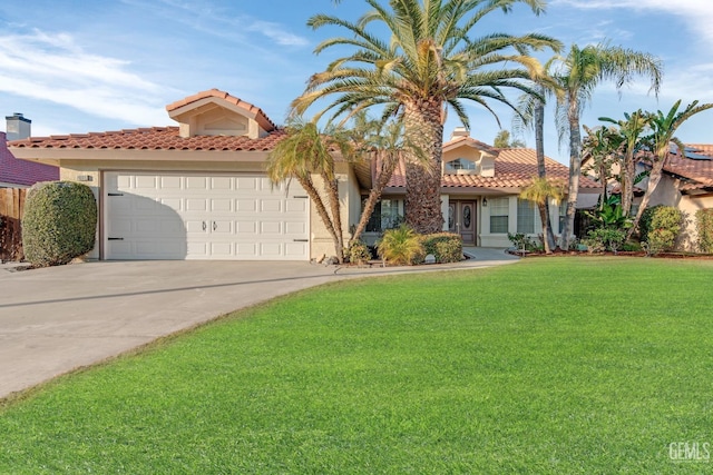 mediterranean / spanish-style home featuring a tile roof, an attached garage, driveway, and a front lawn