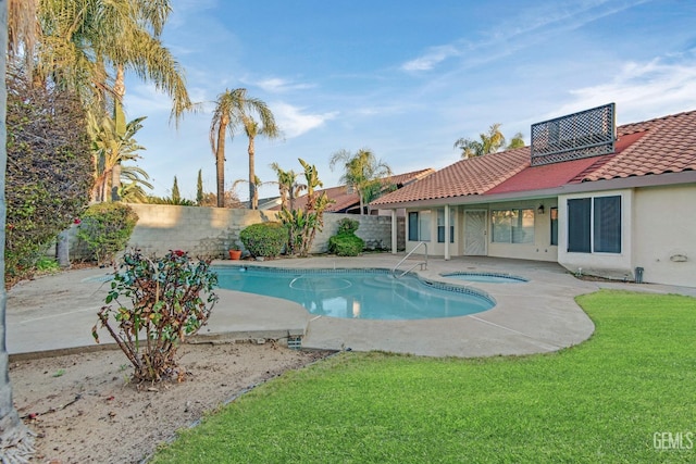 view of swimming pool featuring a fenced in pool, a patio, a fenced backyard, an in ground hot tub, and a yard