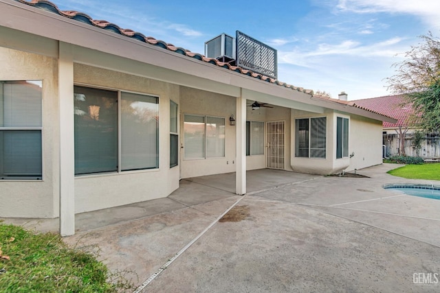 view of patio / terrace featuring ceiling fan and fence