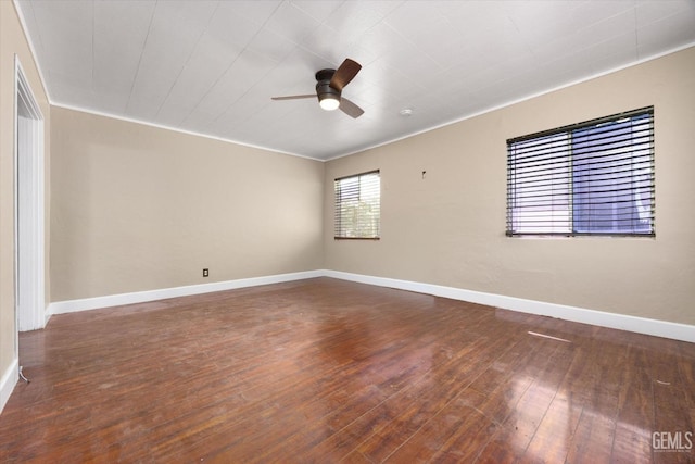 spare room featuring crown molding, ceiling fan, and dark hardwood / wood-style floors