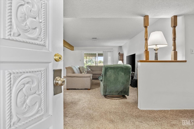 6309 Desert Hills Ave, Bakersfield, CA 93309 - living area featuring carpet floors and a textured ceiling