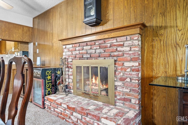 6309 Desert Hills Ave, Bakersfield, CA 93309 - detailed view of wooden walls, a fireplace, carpet floors, a textured ceiling, and a heating unit