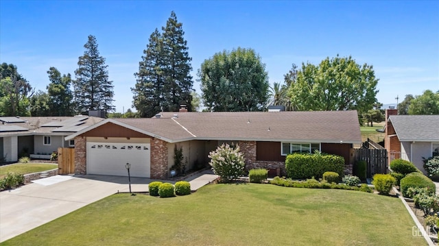 6309 Desert Hills Ave, Bakersfield, CA 93309 - ranch-style house featuring an attached garage, driveway, and brick siding