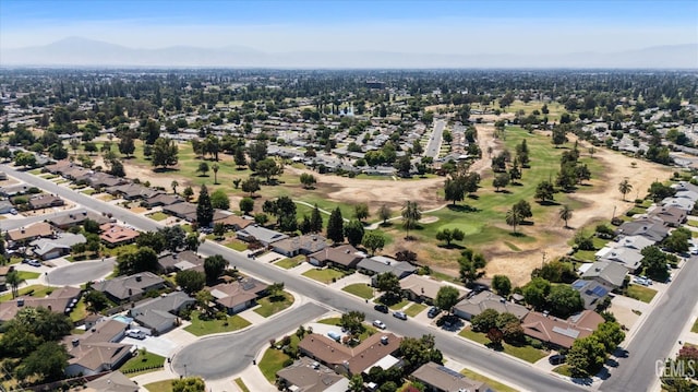 6309 Desert Hills Ave, Bakersfield, CA 93309 - aerial overview of property's location featuring a mountain backdrop and nearby suburban area