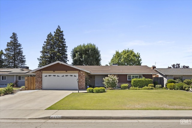 6309 Desert Hills Ave, Bakersfield, CA 93309 - single story home featuring an attached garage, concrete driveway, a front lawn, and brick siding