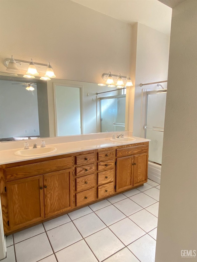5217 Clover Mountain St, Bakersfield, CA 93313 - full bathroom featuring double vanity, tile patterned flooring, and a shower with door