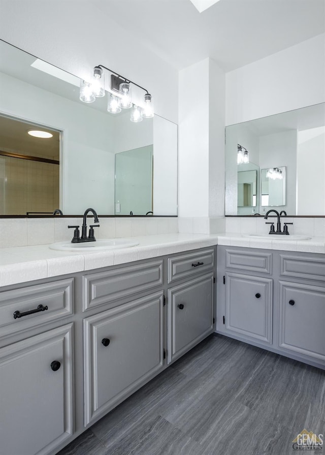 bathroom featuring hardwood / wood-style flooring and vanity