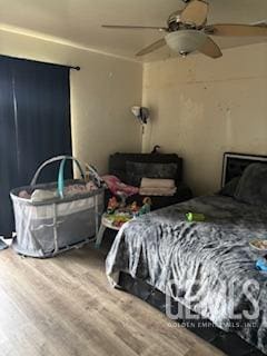 bedroom featuring ceiling fan and wood finished floors