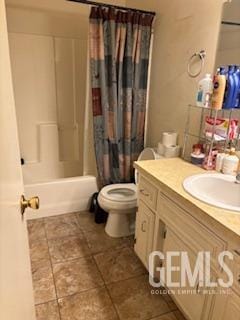 full bath with vanity, shower / bath combination with curtain, toilet, and tile patterned flooring