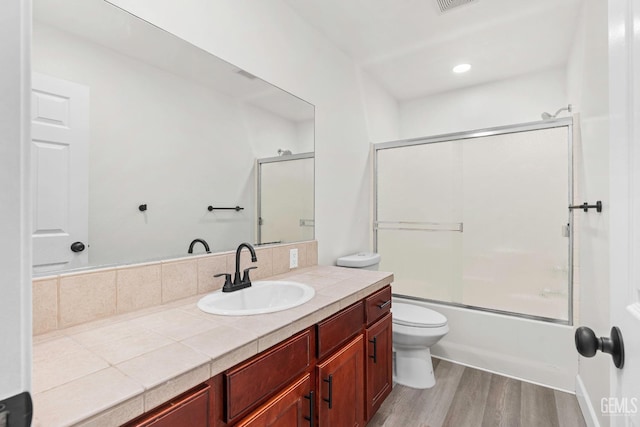9610 Tahiti Ave, Bakersfield, CA 93311 - full bath featuring vanity, wood finished floors, and combined bath / shower with glass door