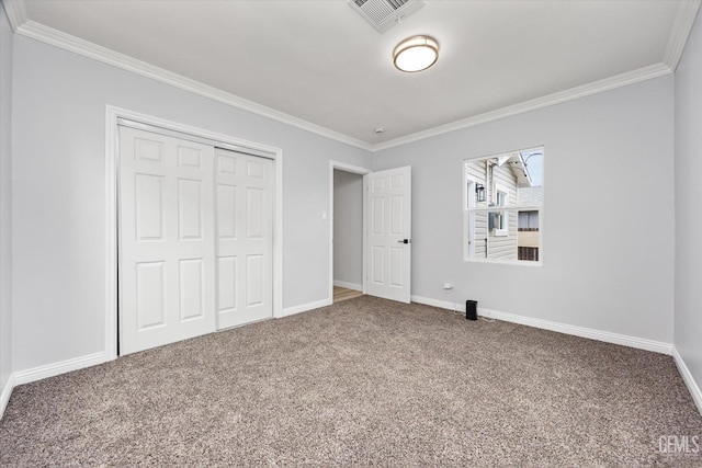 unfurnished bedroom featuring visible vents, ornamental molding, carpet, and baseboards