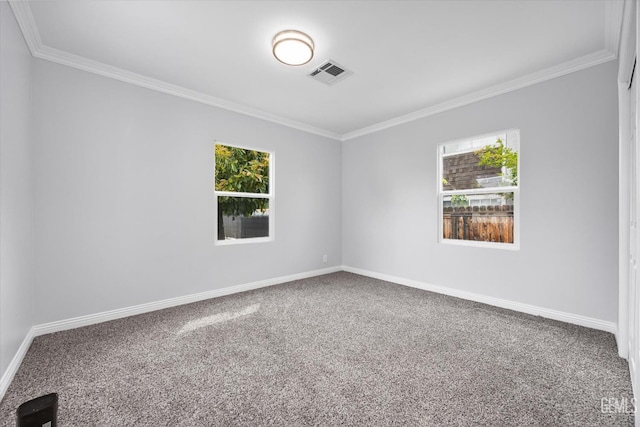 unfurnished room featuring crown molding, a wealth of natural light, carpet, and visible vents