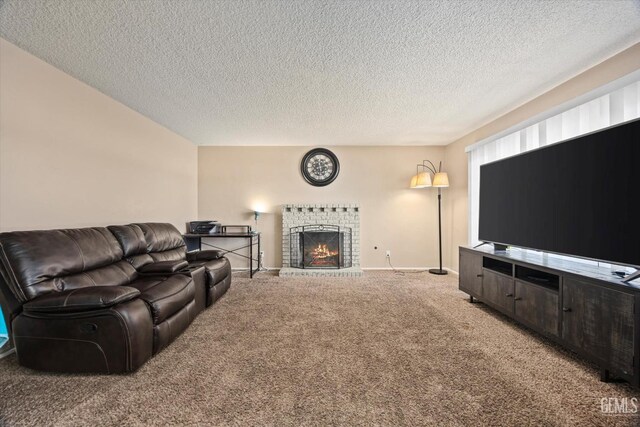 carpeted living area featuring baseboards, a textured ceiling, and a fireplace