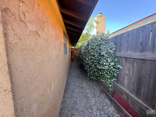 4105 Thatch Ave, Bakersfield, CA 93313 - view of side of property featuring stucco siding and fence