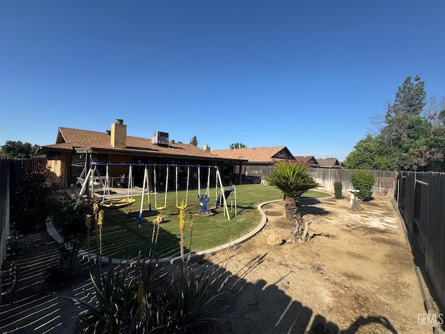 4105 Thatch Ave, Bakersfield, CA 93313 - view of yard featuring a playground and cooling unit