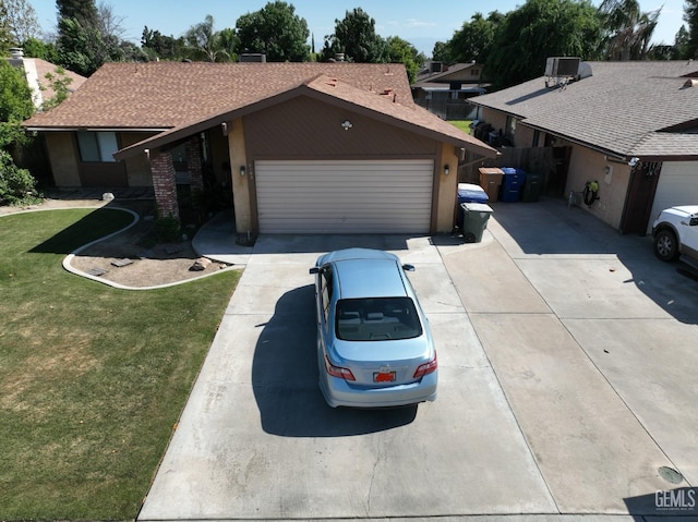 4105 Thatch Ave, Bakersfield, CA 93313 - single story home featuring driveway, an attached garage, and stucco siding