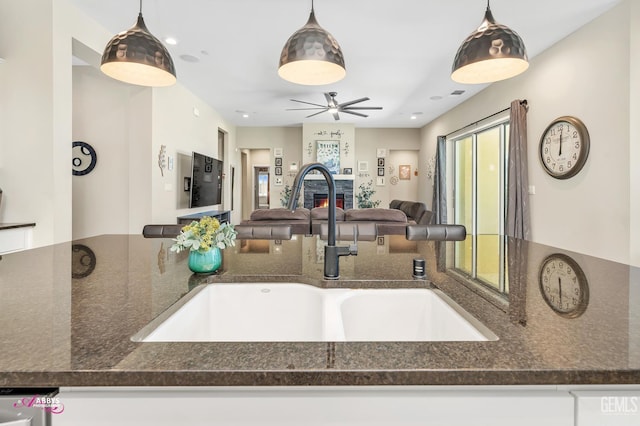 802 Barre Ct, Bakersfield, CA 93314 - kitchen with dark stone counters, a ceiling fan, decorative light fixtures, open floor plan, and recessed lighting