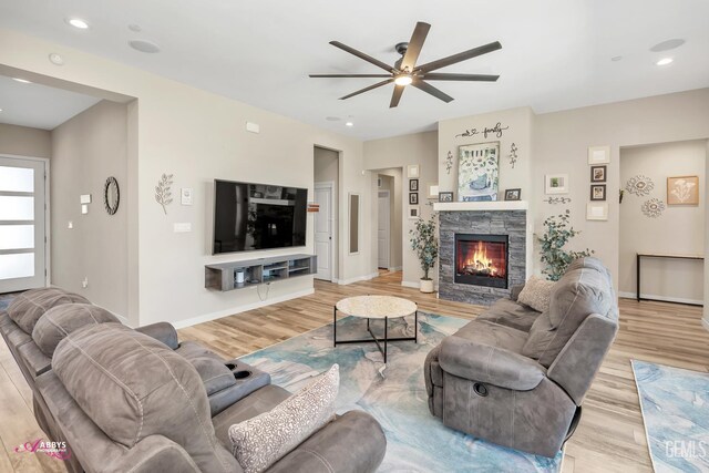 802 Barre Ct, Bakersfield, CA 93314 - living room featuring a ceiling fan, light wood finished floors, a fireplace, and recessed lighting