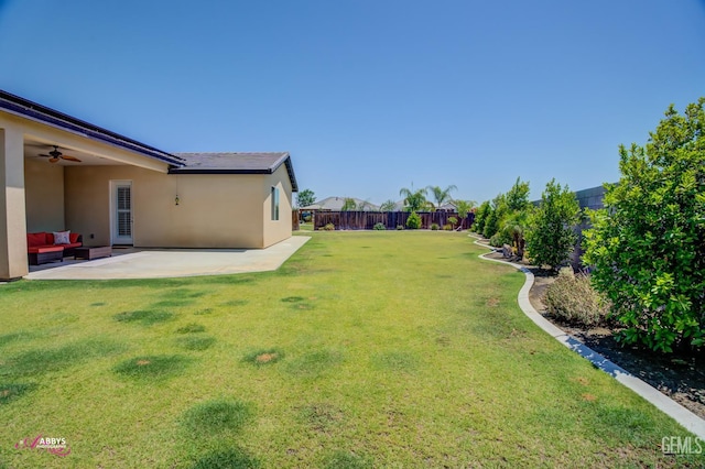 802 Barre Ct, Bakersfield, CA 93314 - fenced backyard featuring a patio area, ceiling fan, and an outdoor living space