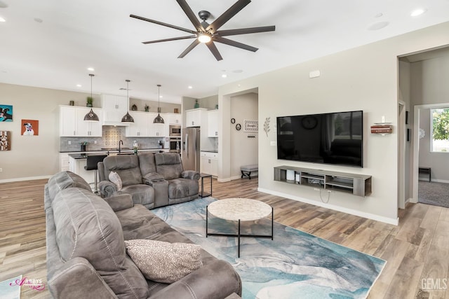 802 Barre Ct, Bakersfield, CA 93314 - living room featuring ceiling fan, light wood-style floors, and recessed lighting