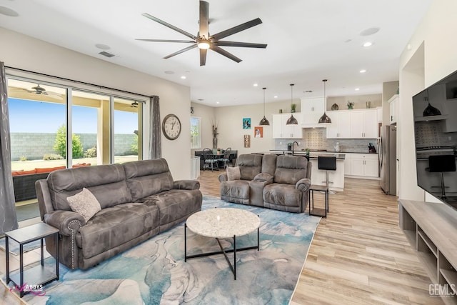 802 Barre Ct, Bakersfield, CA 93314 - living room featuring ceiling fan, light wood-type flooring, and recessed lighting