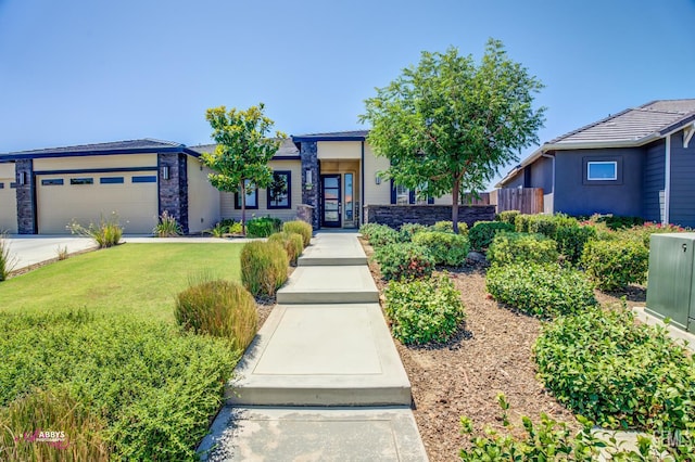 802 Barre Ct, Bakersfield, CA 93314 - view of front of property with stone siding, a garage, a front lawn, and driveway